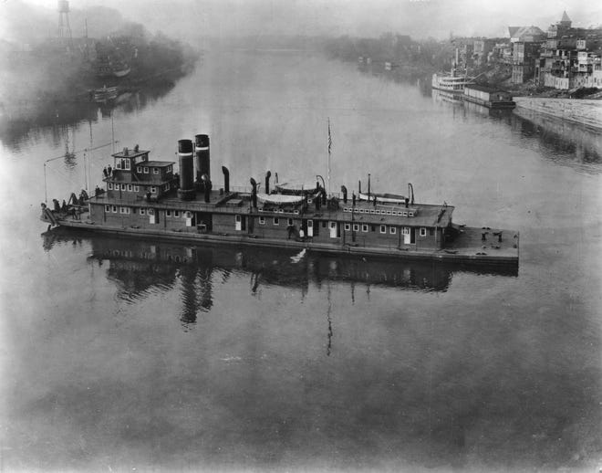 An undated Press Photo shows a cargo steamship on the Mississippi River, location also unknown.