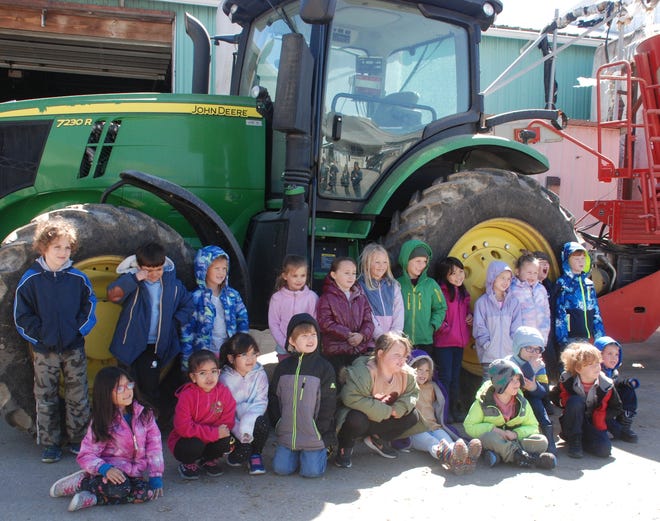 Kids from three different Waunakee kindergarten classes visited Ripp’s Dairy Valley last week and one of the highlights was posing next to Chuck Ripp’s tractor and feed mixer as their teachers and parents took photos.