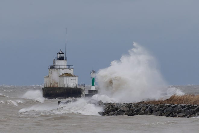 Waves crash against a breakwall along the Lake Michigan shoreline during a winter storm Saturday, Apr. 14, 2018, in Manitowoc, Wis. Josh Clark/USA TODAY NETWORK-Wisconsin