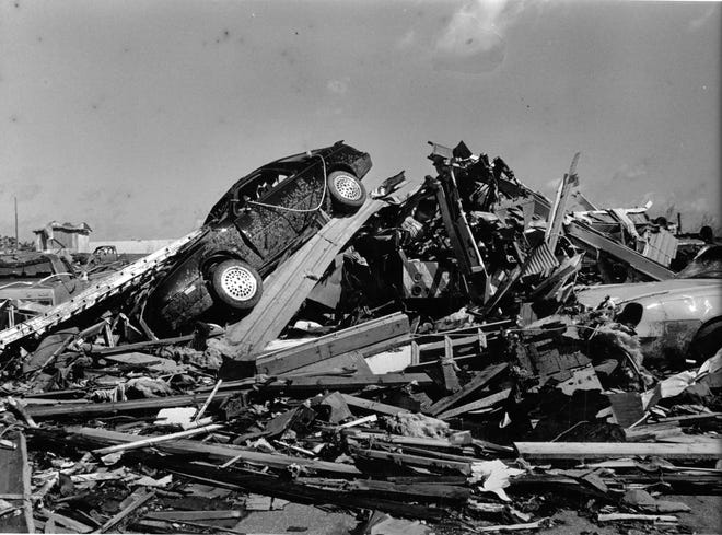 Many tornadoes show a telltale “hook” shape on radar, but Barneveld’s tornado did not. 

Among the scenes of destruction at Barneveld was a car tossed on a pile of debris that included other buried vehicles.