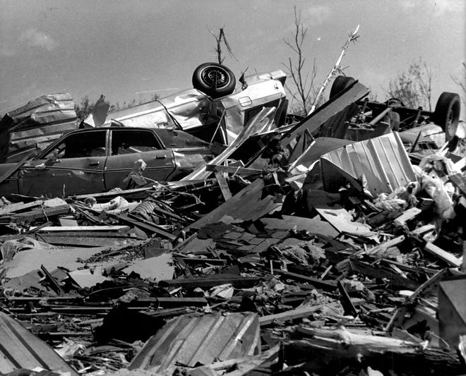 Cars lie in piles like discarded toys after the Barneveld tornado.