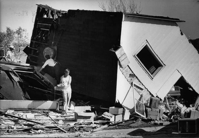 A majority of tornadoes occur between 3 and 9 p.m. and violent tornadoes almost never happen late at night. People salvage some items from their destroyed house in Barneveld.