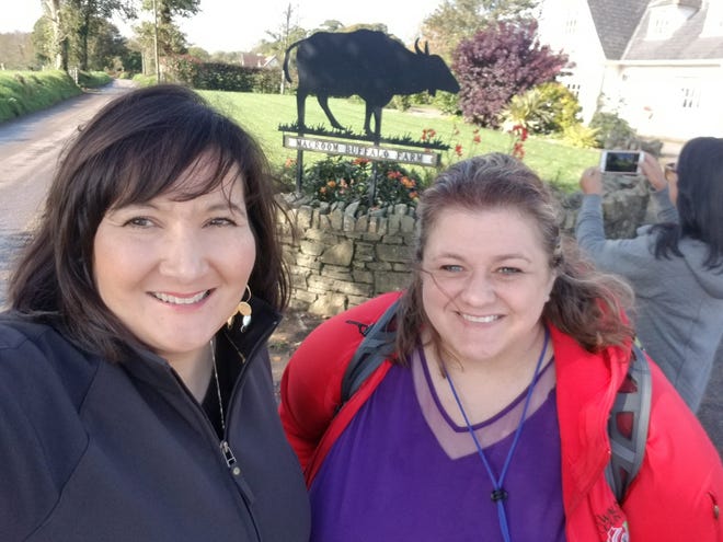 Extension educators Tina Kohlman, left, and Aerica Bjurstrom visit Macroom Buffalo farm.
