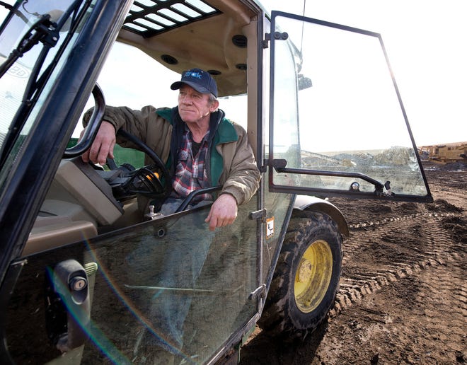 In this Friday, Dec. 27, 2019 photo, farmer Kurt Kaser takes a break from moving chunks of concrete during an interview, at his farm in rural Pender, Neb. In April, Kaser's left leg was partially amputated after stepping into a running grain auger and he used his pocket knife to sever the remaining tissue before crawling to his home to call for help. Since the accident, he is on his second prosthetic leg and has traveled to Germany to appear on a television show.