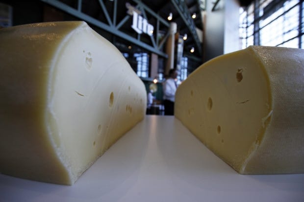 A freshly cut wheel of swiss cheese sits at the atrium at Lambeau Field in Green Bay, Wis.