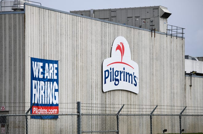 This April 28, 2020 file photo shows the Pilgrim's Pride plant in Cold Spring. Minn. A federal grand jury has charged four current and former chicken company executives with price-fixing. The U.S. Department of Justice says the executives from Colorado-based Pilgrim' Pride and Georgia-based Claxton Poulrty conspired to fix prices and rig bids for broiler chickens from at least 2012 to 2017.(Dave Schwarz/St. Cloud Times via AP)