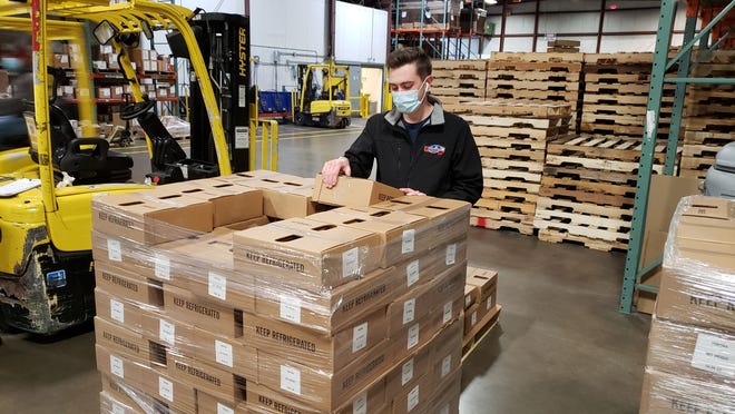 A delivery of cheese products from Emmi Roth arrives at the Second Harvest Food Bank in Madison. An information platform is helping to make the process of connecting food banks with food suppliers transparent.