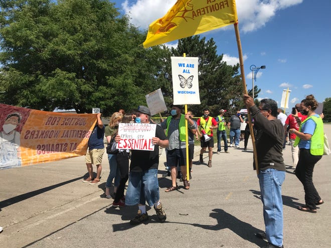 Workers, advocates and supporters protested outside a Strauss Brands plant in Franklin over the firing of 30 employees and demanded better severance conditions, an action organized by advocacy group Voces de la Frontera.
