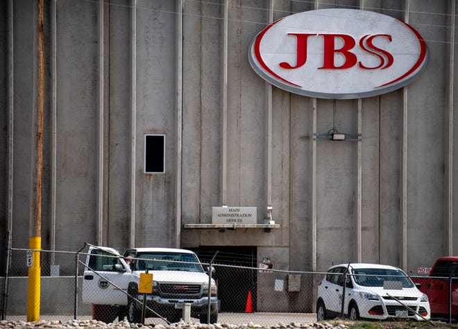 Meatpacker JBS Foods Inc. faces about $59,000 in fines after a worker fell into vat of chemicals used to process animal hides and died at one of the company's meat processing facilities in northern Colorado, officials said.