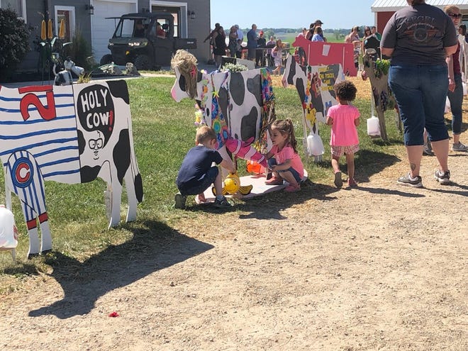 The lineup of “Crafty Cows” offered a play place for these kids.
