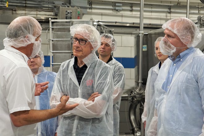 Master cheesemaker Steve Stettler leads Governor Tony Evers and DATCP Secretary-designee Randy Romanski on a tour of Decatur Dairy's cheese plant June 17, 2021.