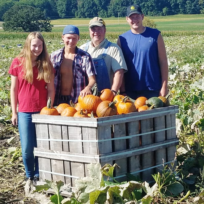 Randy Tietz and his sons Jacob and Christian and daughter Angela are busy picking pumpkins on their Lebanon farm for the busy fall season.  They spent Labor Day, as they always do, laboring in the field.  They are the sixth and seventh generations to operate this farm.