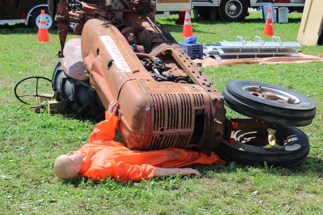 The Pittsville Fire Department and the National Farm Medicine Center teamed up to share safety messages at Farm Technology Days. A tractor roll-over demonstration shows how a ROPS (roll-over protection structure) can save lives, while the PFD performed a live grain entrapment rescue.