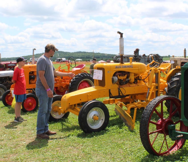 An Allis Chalmer tractor outfitted with a grader blade attracted attention at Farm Technology Days in Clark County, July 12-14, 2022.
